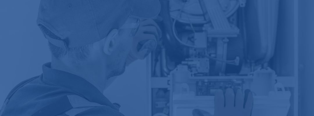 Repaiirman working on a gas furnace.